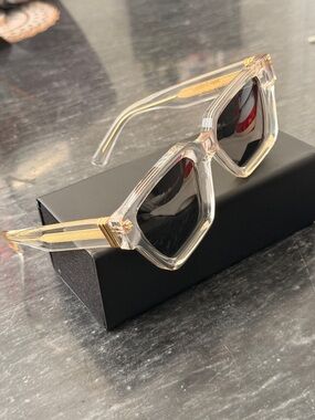 James Oro Clear Frame Sunglasses with Gold Accents and Black Lenses